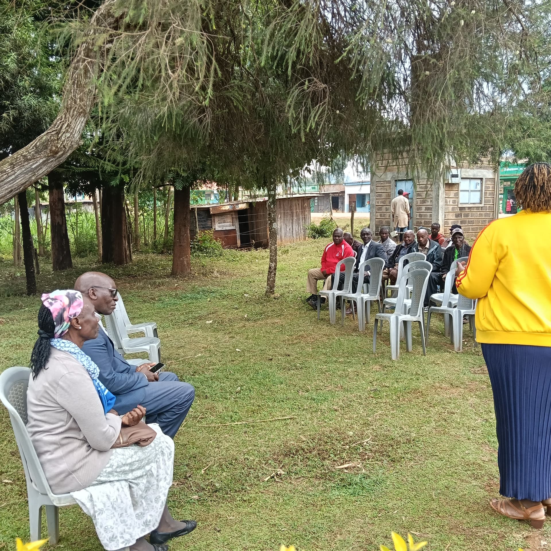 The community gathered in the town square just outside the clinic to celebrate the start of the restoration.